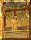 Au centre du retable: un christ devant une croix aux instruments.